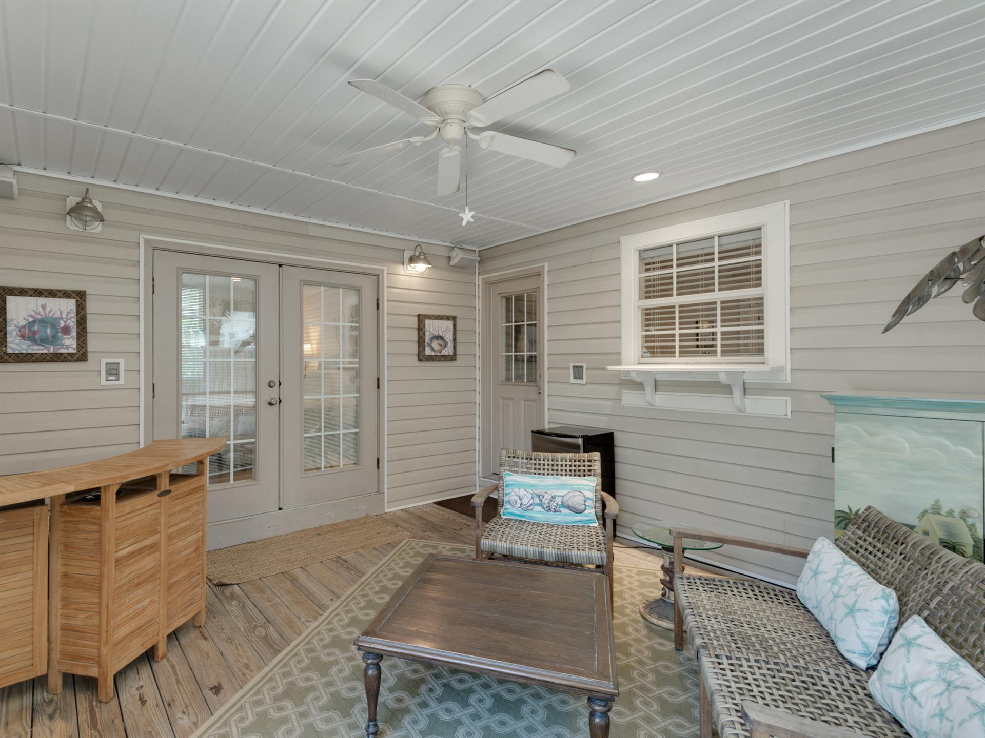 Spend your evening relaxing in the screened in back porch