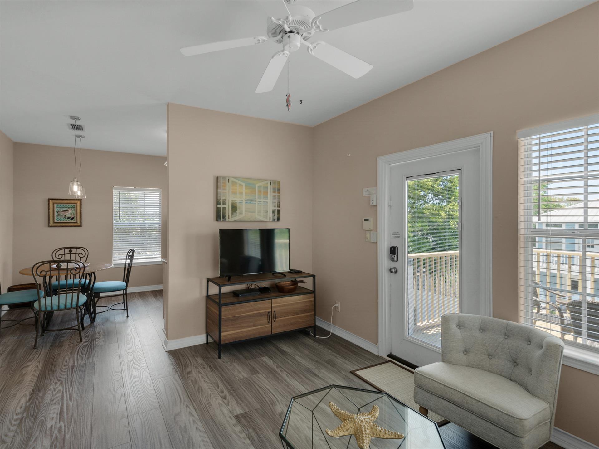 Carriage house living room with flat screen TV
