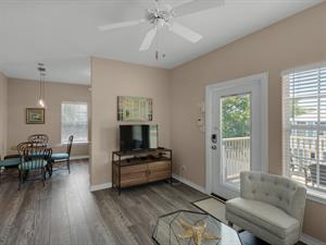 Carriage house living room with flat screen TV