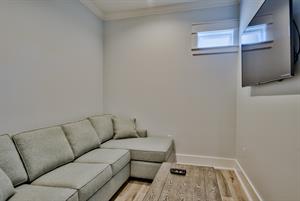 2nd floor sitting area with sofa sleeper and TV