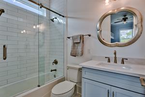 2nd floor bunk room bathroom offering tub and shower