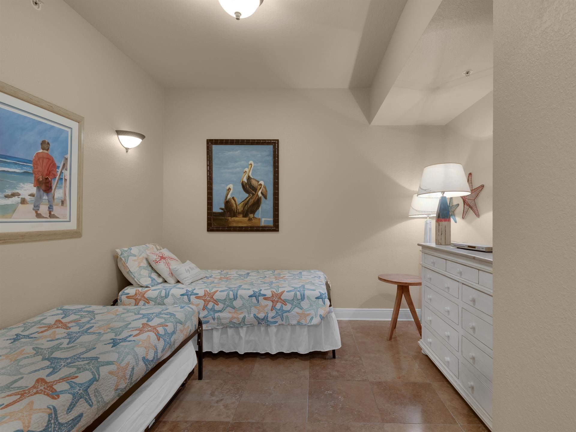 Guest bedroom with twin beds and one trundle