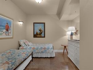 Guest bedroom with twin beds and one trundle