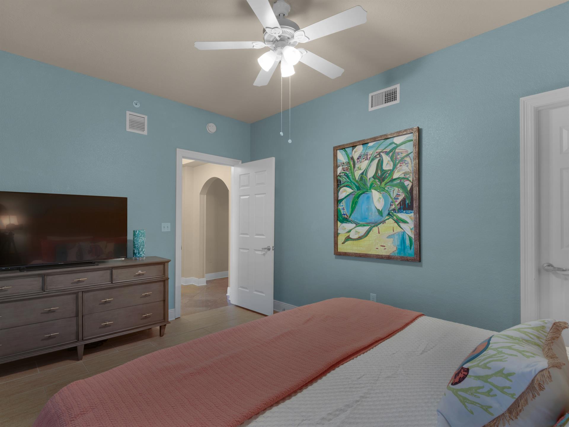 Guest bedroom with large TV