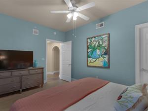 Guest bedroom with large TV