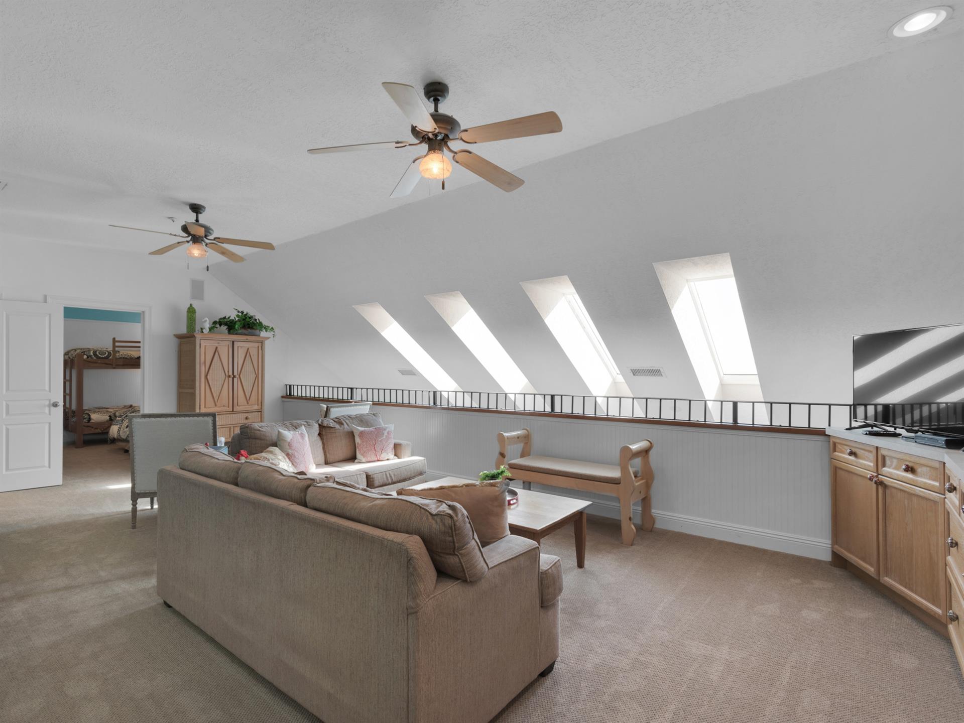 Loft Sitting Area with Large Flat Screen TV