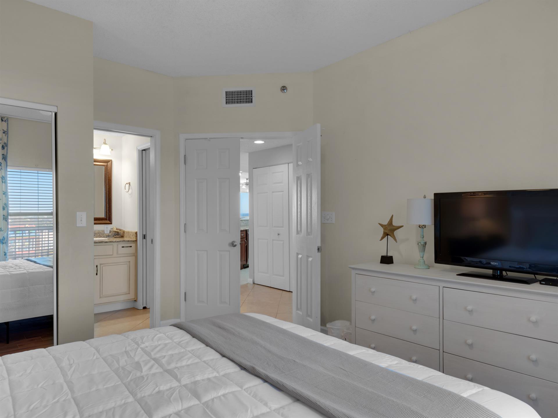 Guest Bedroom with Queen Bed and Flat Screen TV