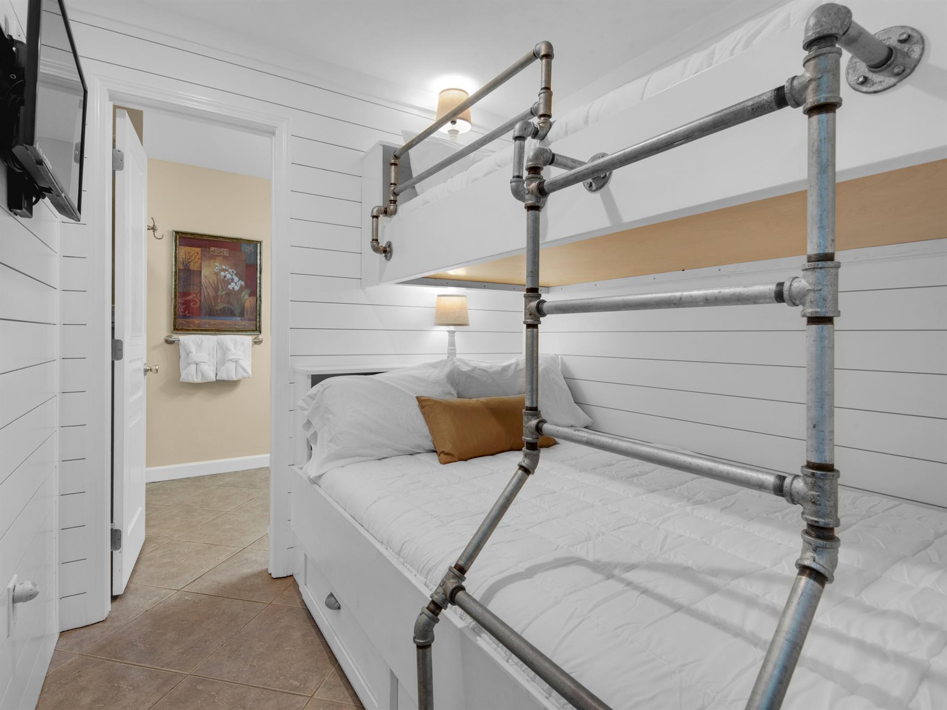 Unique bunk area with double bed on the bottom and twin on top