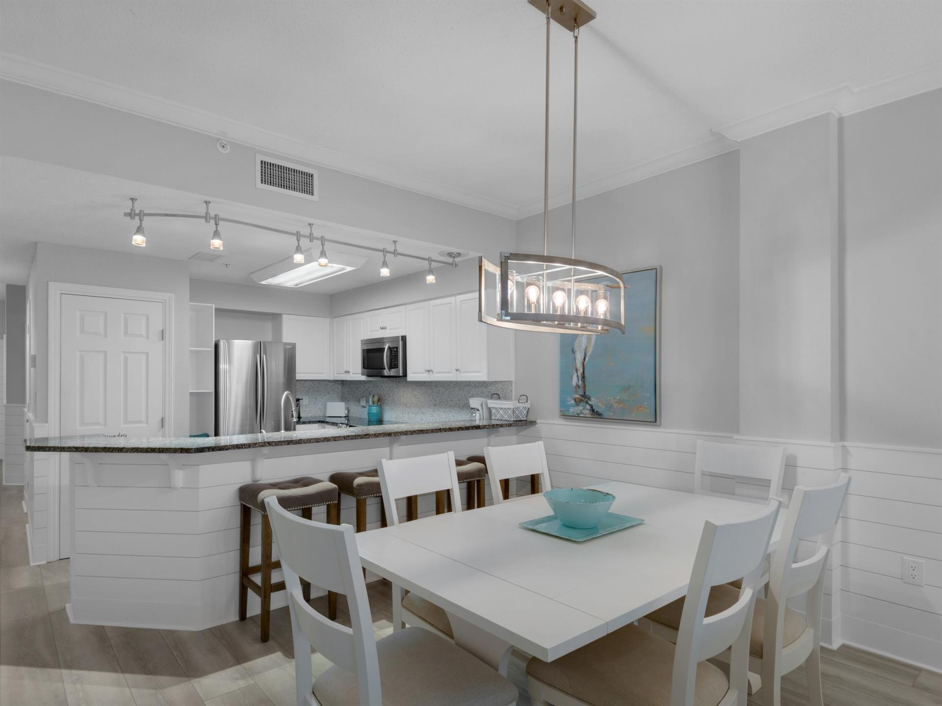 Dining area with additional seating at breakfast bar