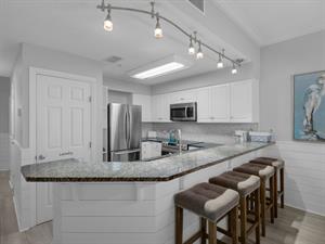 Kitchen area providing breakfast bar seating