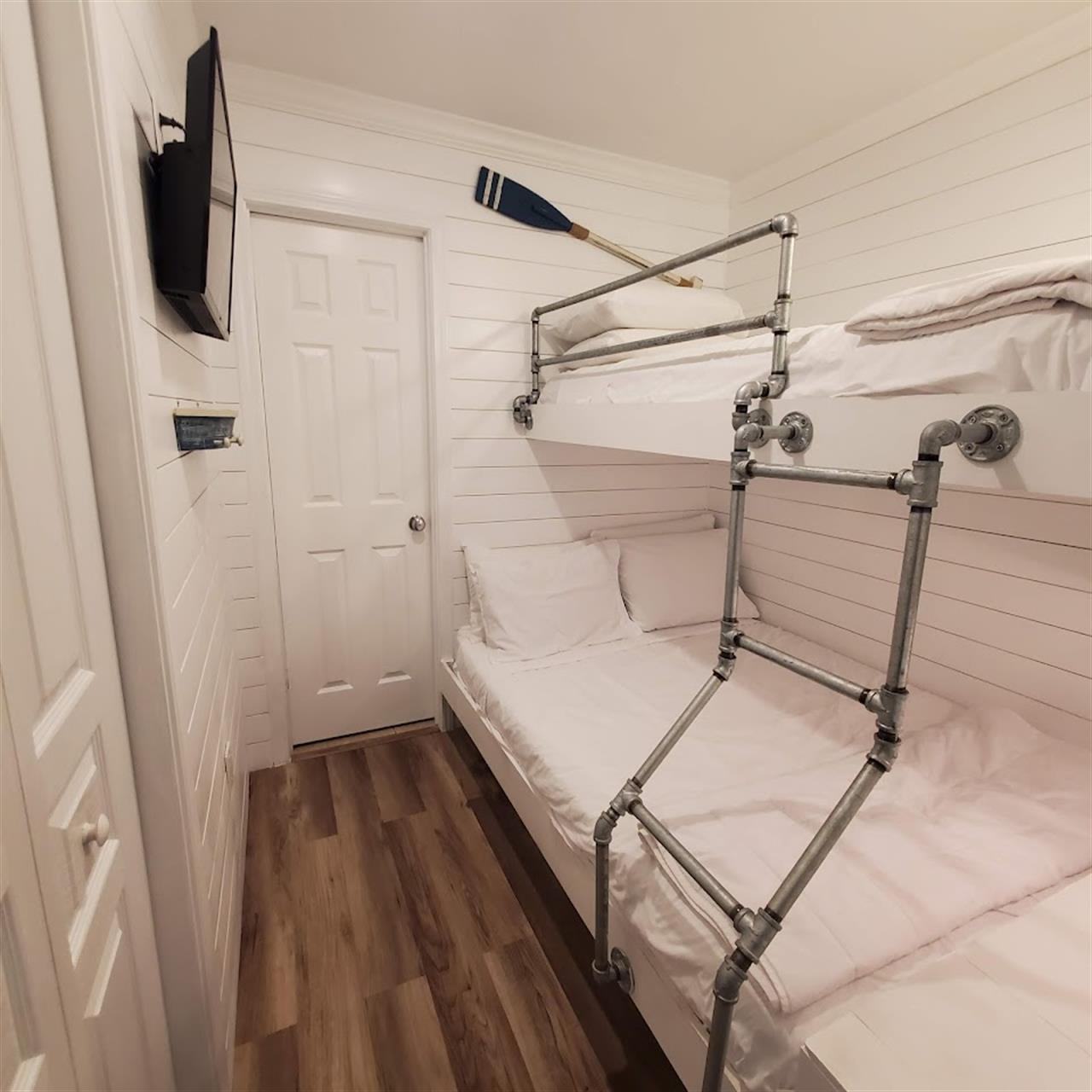 Bunk area with custom made double bed on bottom and twin on top