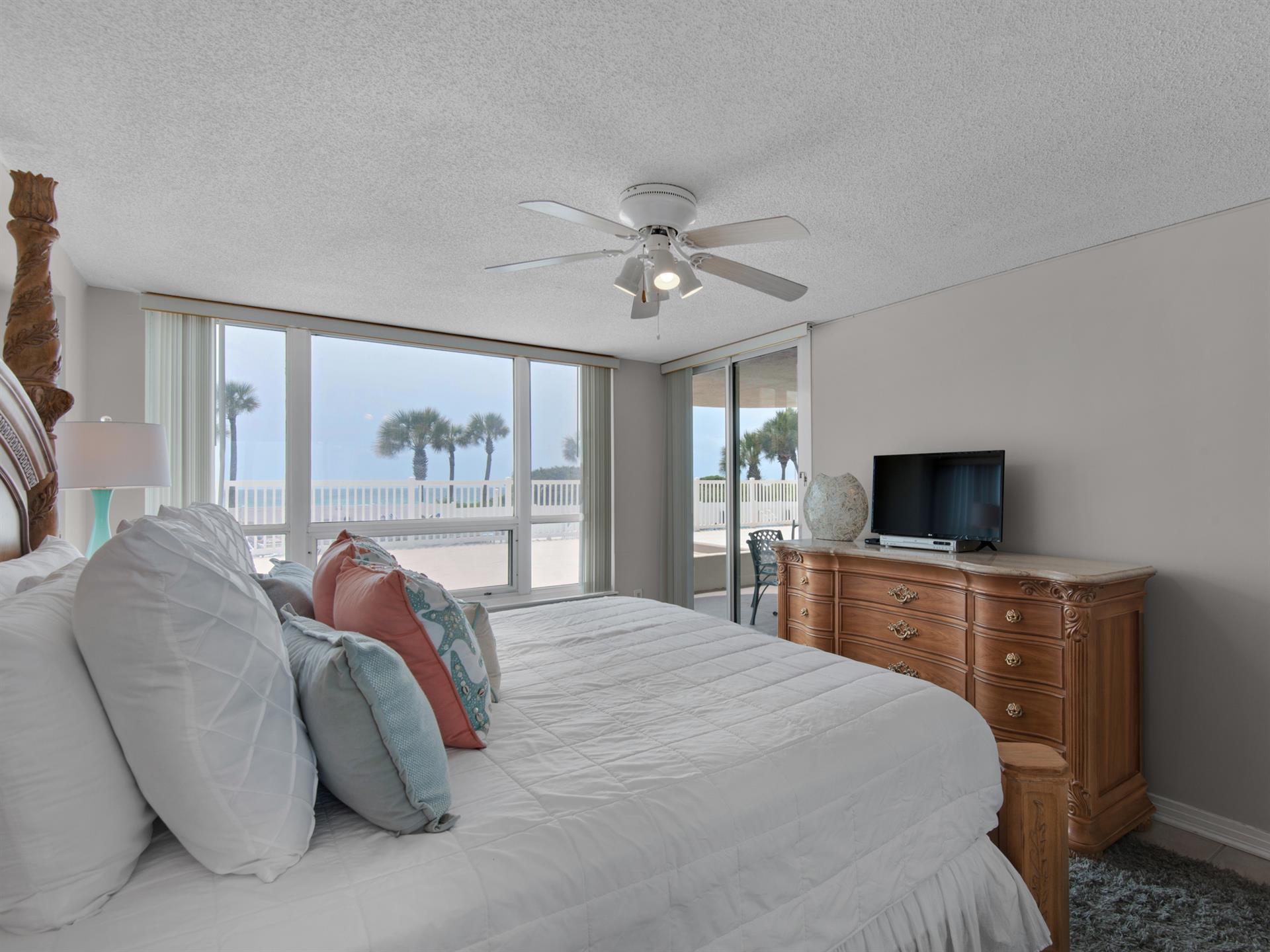 Primary Bedroom with Private Entrance to Patio and Flat Screen TV
