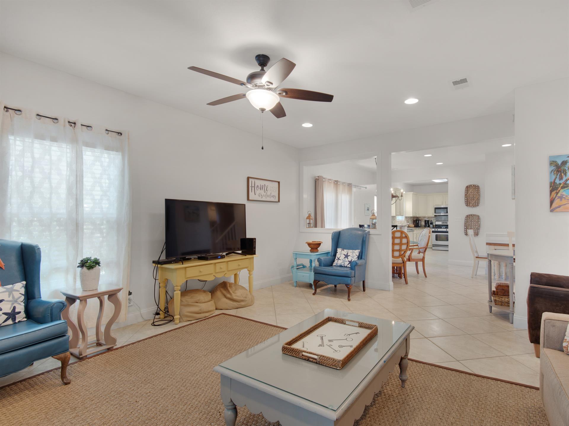 Living area opens into dining area and kitchen