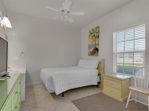 1st floor guest bedroom 2 with 2 full beds and TV