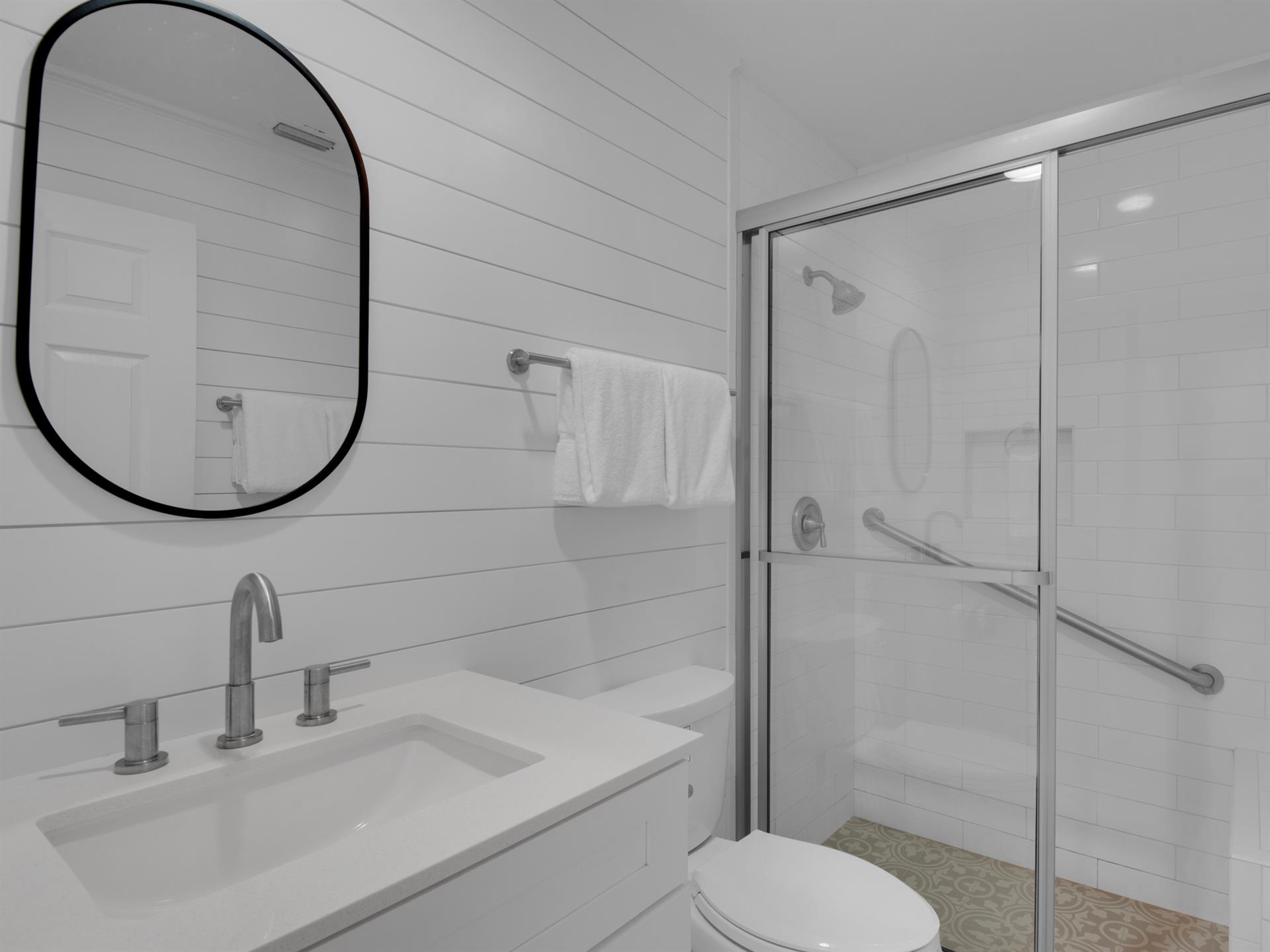 1st Floor shared bathroom with ADA compliant walk in shower