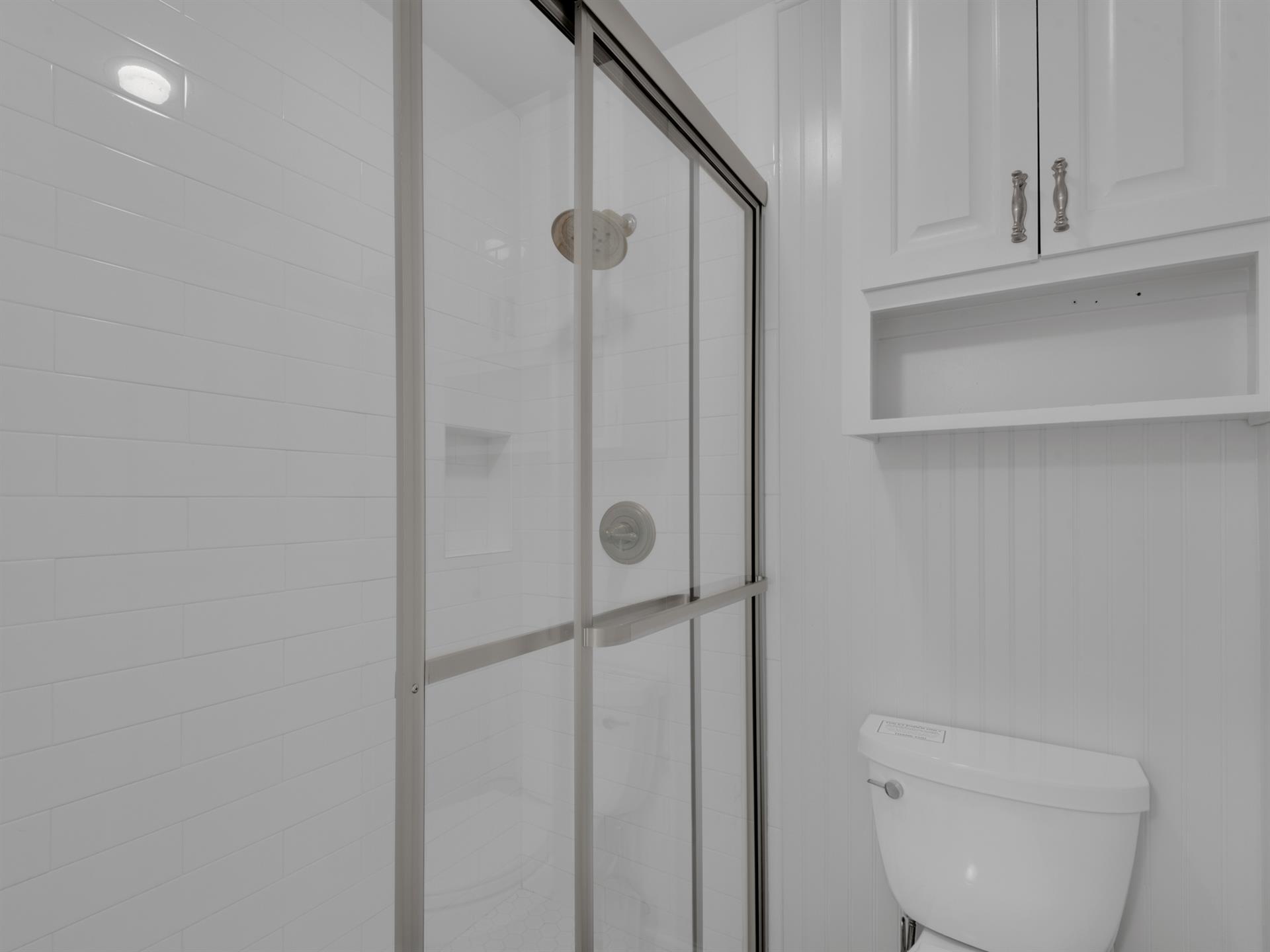 2nd floor queen guest bedroom 5 with private bathroom providing walk in shower