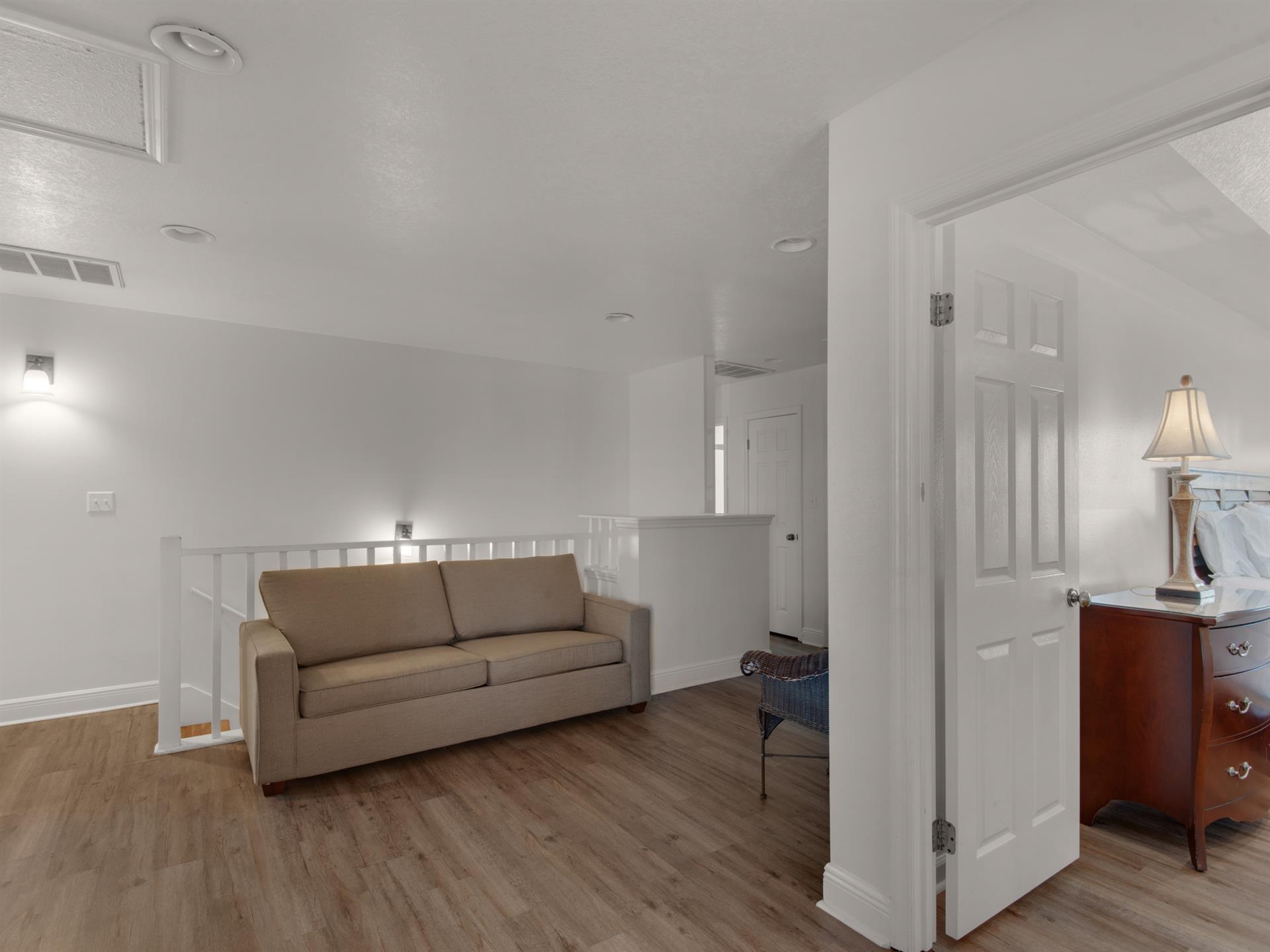 2nd floor sitting area with a Cozy Sleeper deluxe with 8.5 sleeper mattress