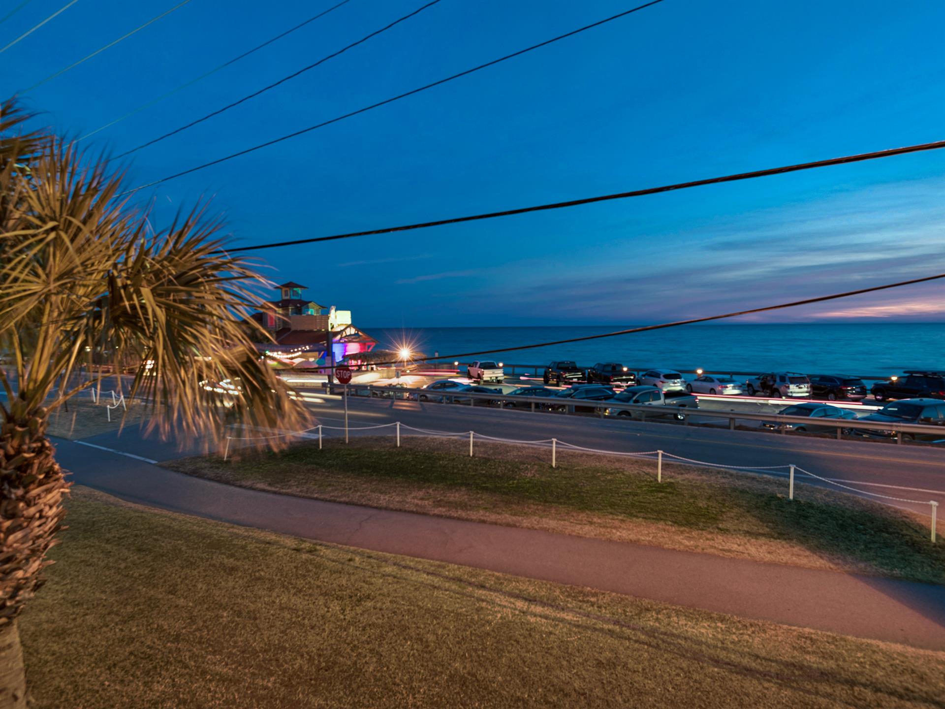 Twilight view of Pompano Joes across the street