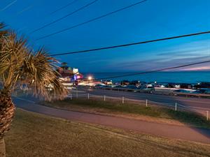 Twilight view of Pompano Joes across the street