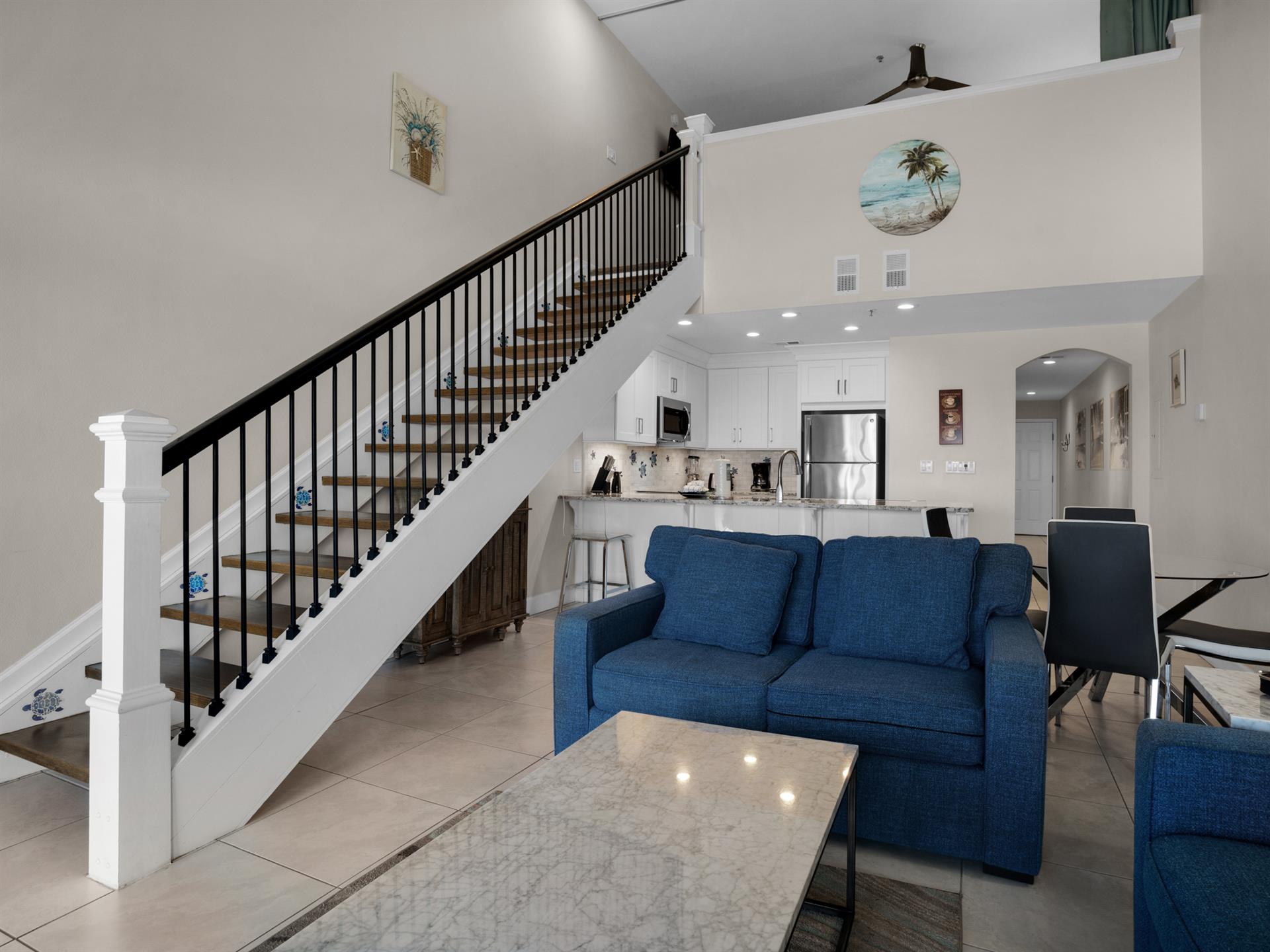 Stairs to queen loft then go through loft room to get to 3rd bedroom