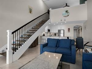 Stairs to queen loft then go through loft room to get to 3rd bedroom