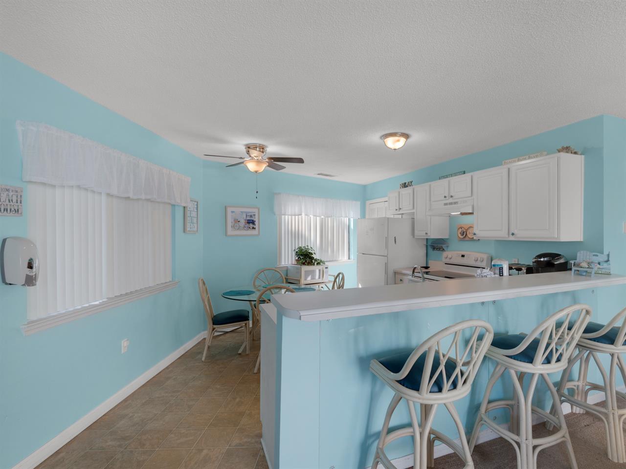 Dining area with additional seating at breakfast bar