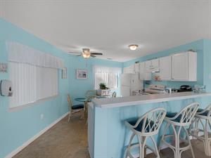 Dining area with additional seating at breakfast bar