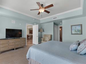 primary bedroom with large flatscreen TV