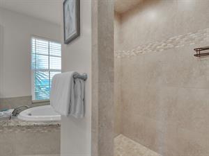 Primary bath with walkin shower and garden tub