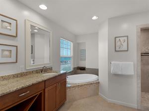 Private Primary bathroom with tub and walk in shower