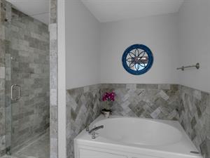 Primary bathroom with walk in shower and soaking tub