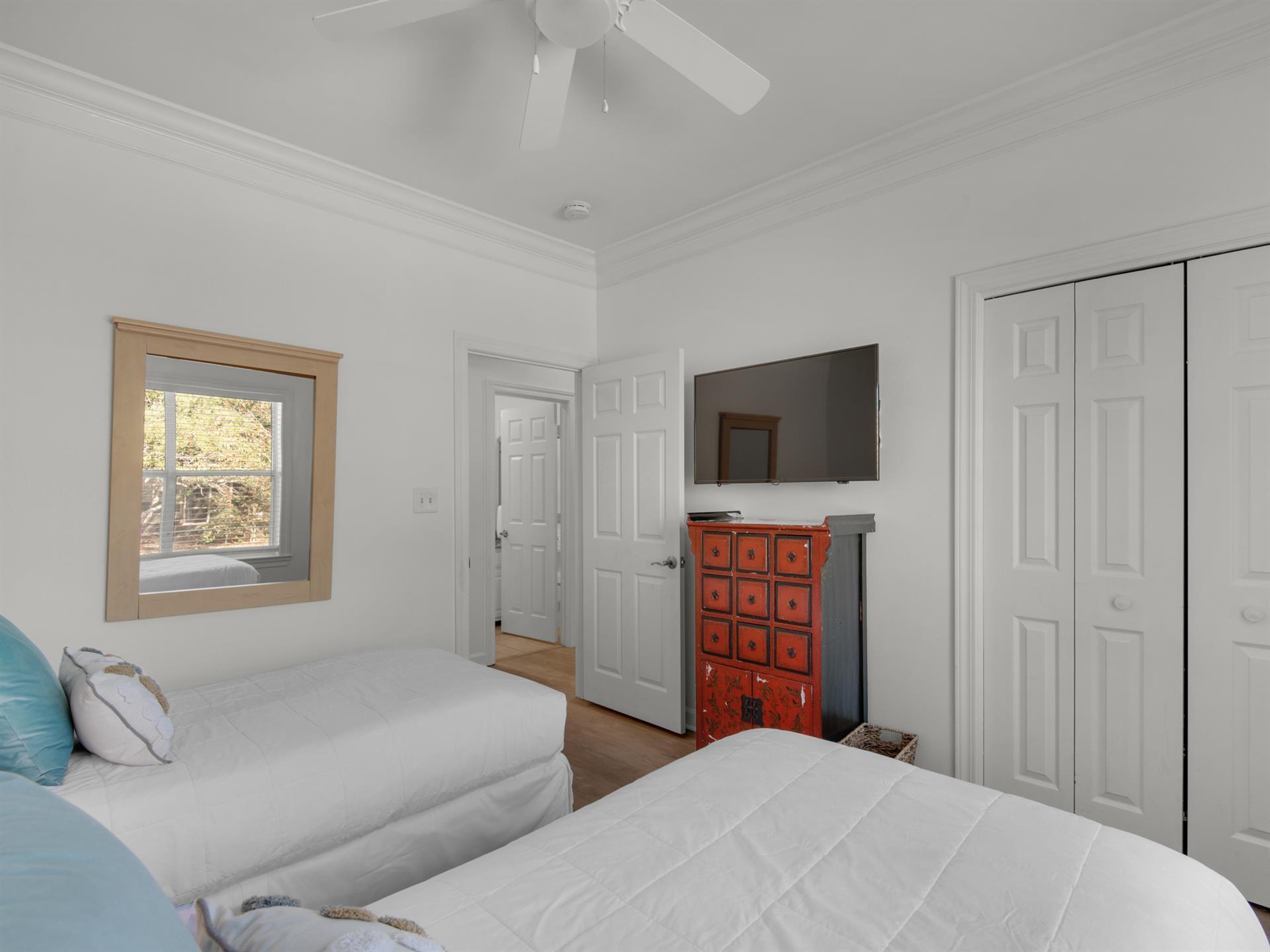 Flat Screen TV in Twin Guest Bedroom