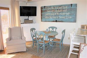 Large flat screen TV and dining area