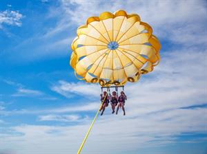 Free adult admission on a Parasailing excursion in season