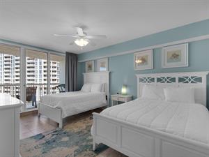 Guest Bedroom 1 with 2 Double Beds and Access to Private Balcony