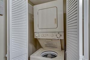 Stackable Washer and Dryer in Hall Bathroom
