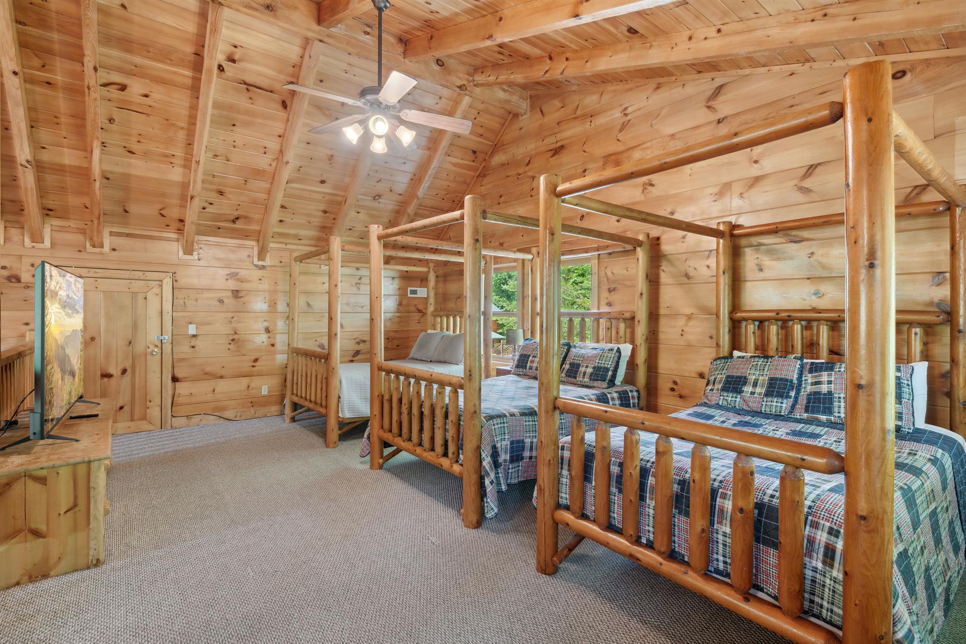 Incredible loft with log canopy beds