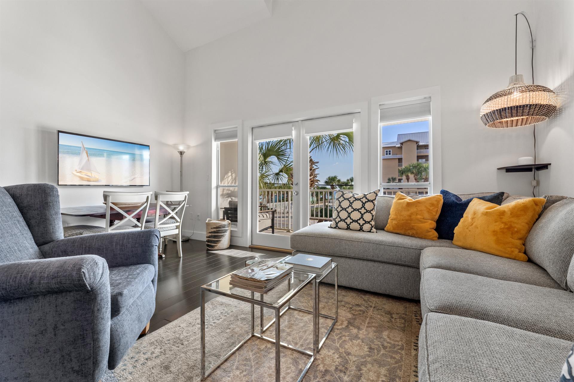 Living Room with Balcony Access and Flat Screen TV