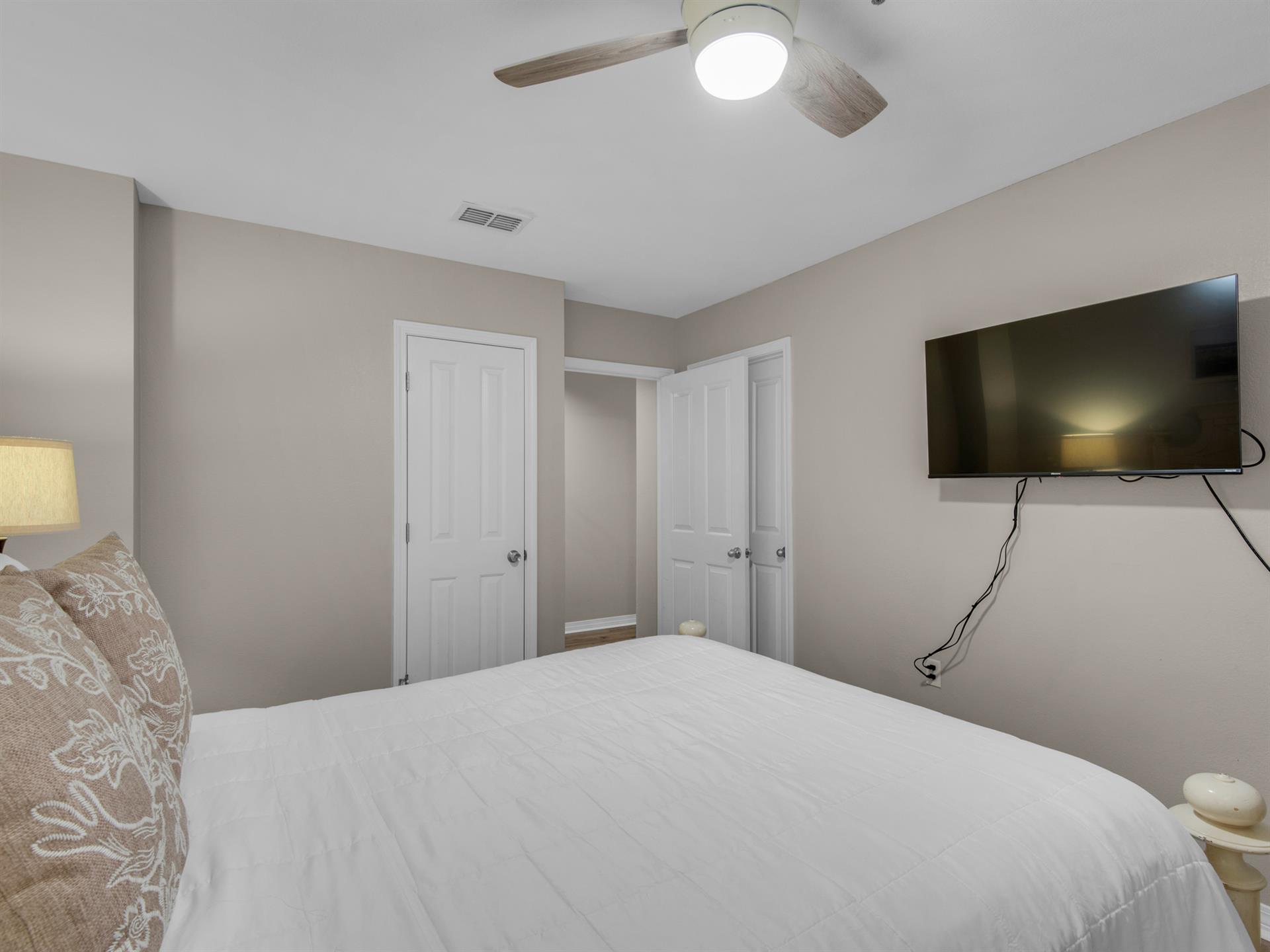 Guest Bedroom with Queen Bed and Flat Screen TV