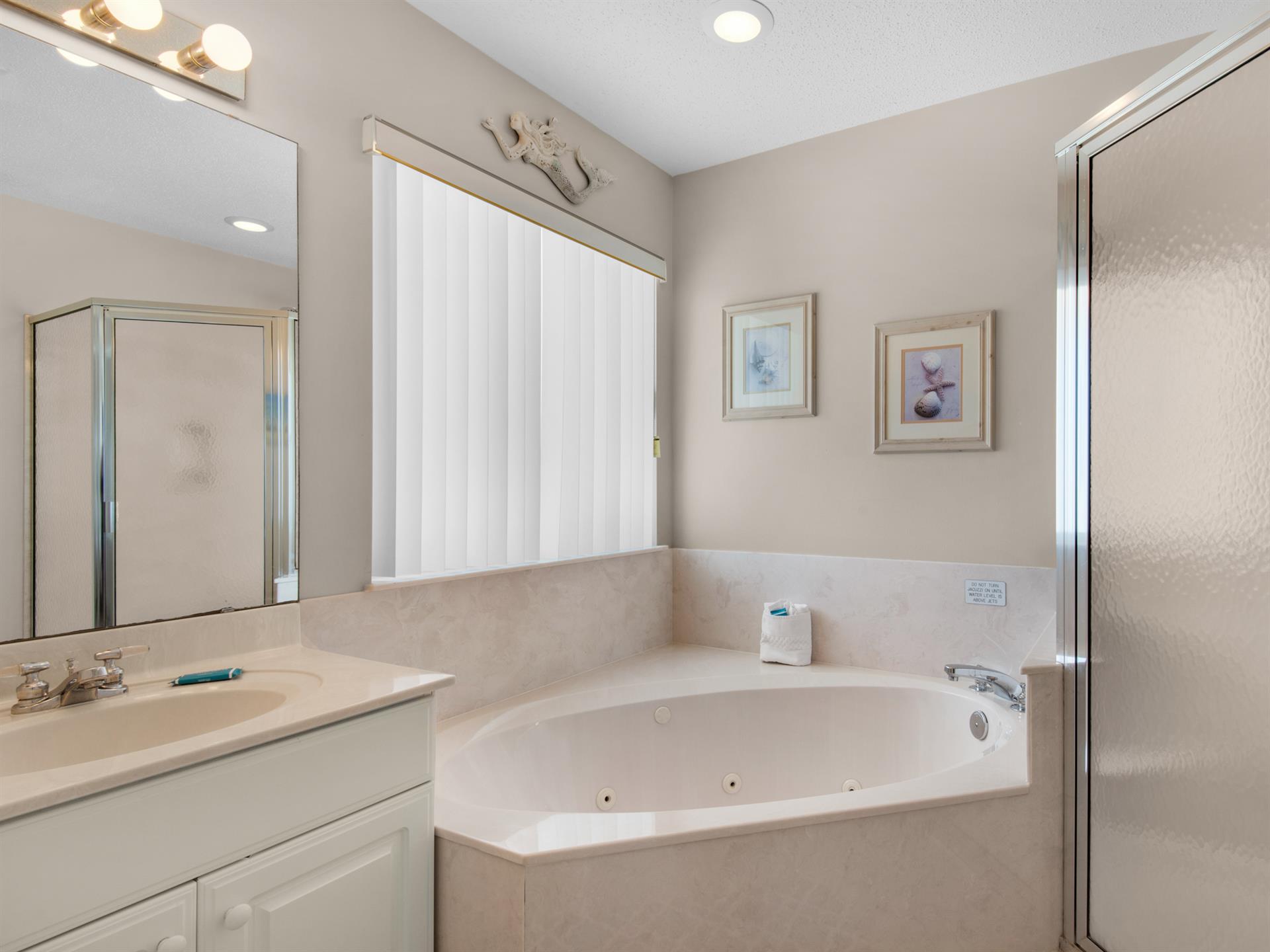 Primary bathroom with walkin shower and garden tub