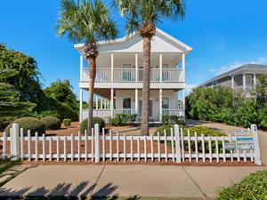 Sunkissed Cottage with white picket fence